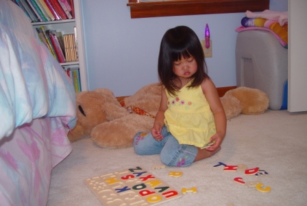 Kasen doing her ABC puzzle